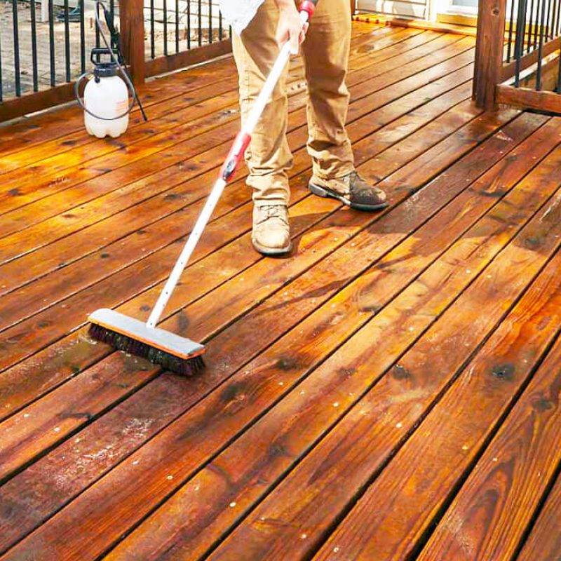 man-applying-stain-on-deck